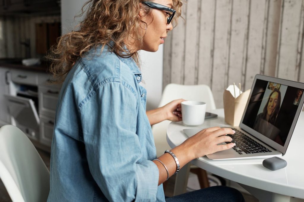 Woman Video Chatting in Blue Denim Jacket